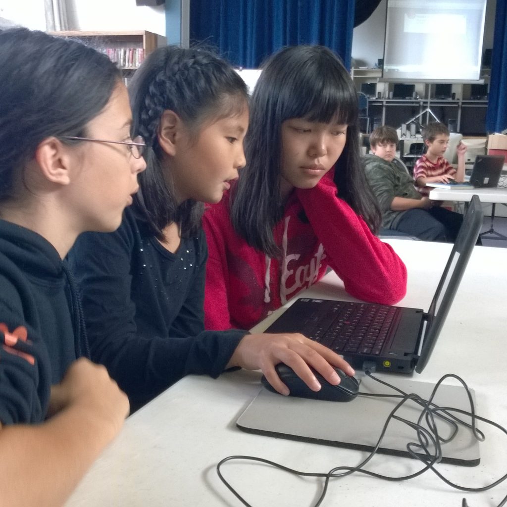Three Girls Using A Computer For Hour Of Code